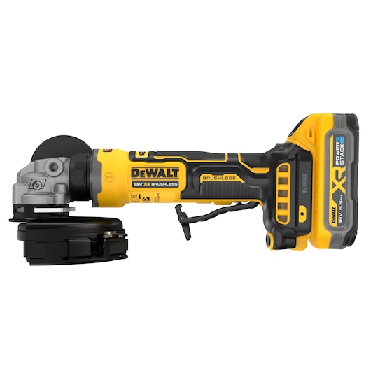 A DEWALT 18V XR brushless angle grinder, featuring a yellow and black design, with a POWERSTACK battery attached. The tool is shown from the side with prominent DEWALT branding and technical details visible.
